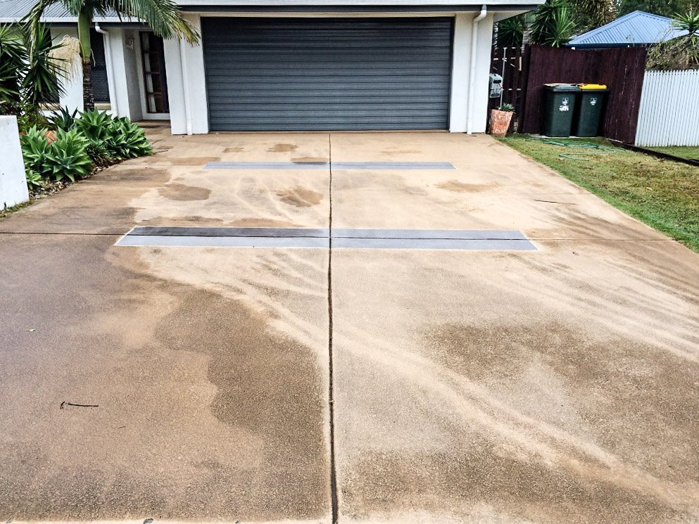 Driveway being professionally pressure cleaned