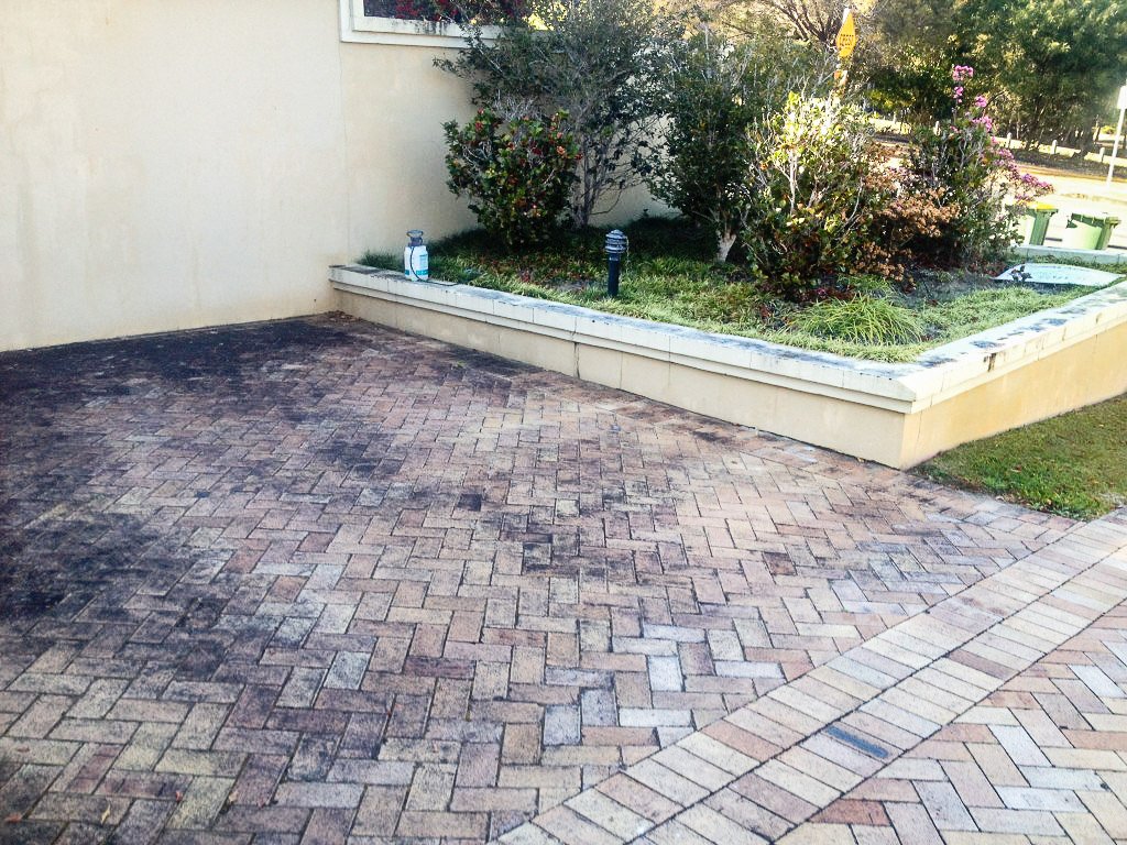 Patio before being professionally pressure cleaned