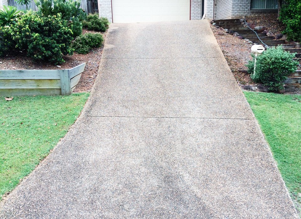 Residential driveway before pressure cleaning