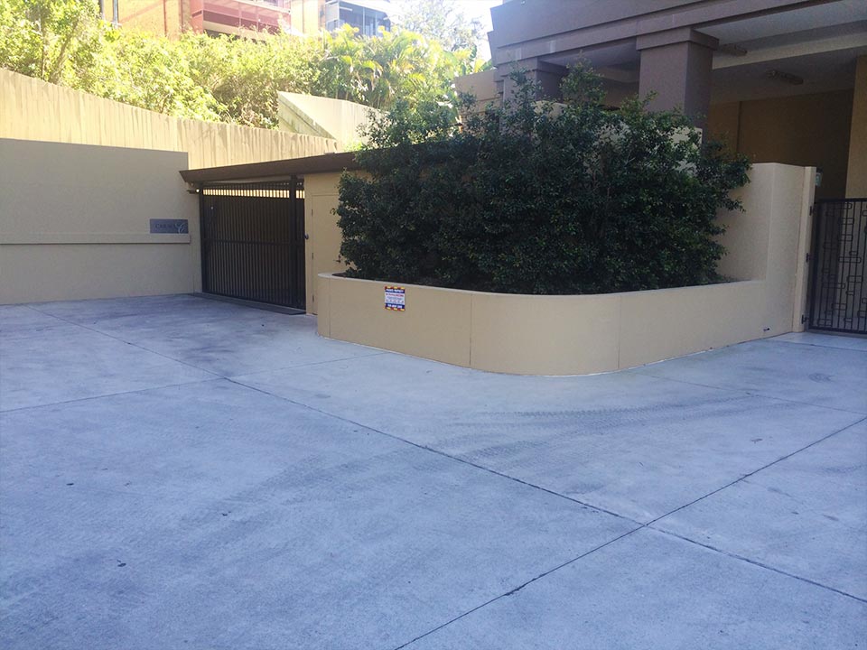 Body corporate driveway before professional cleaning