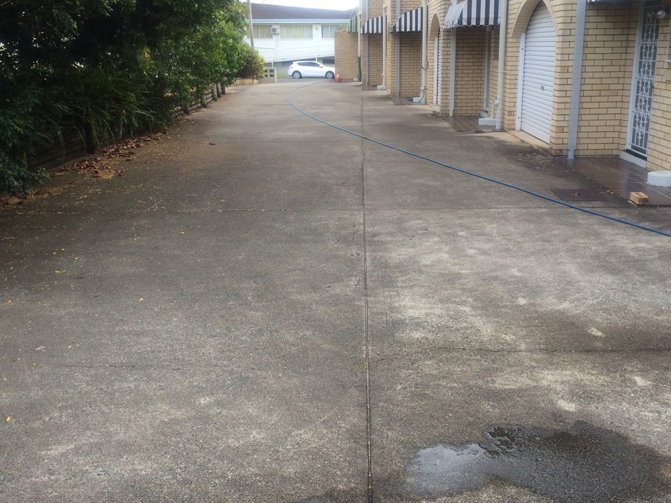 Body corporate driveway before a professional clean