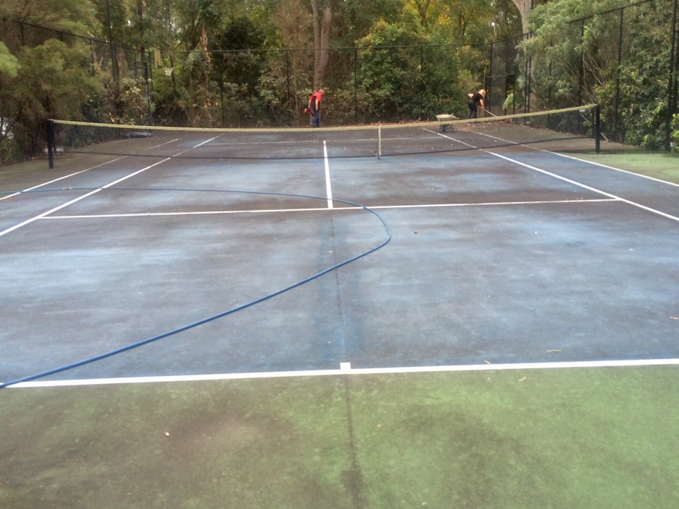 Tennis court before being professionally cleaned