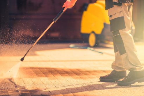 professional using pressure cleaning to clean domestic bricks - MKL Pressure cleaners