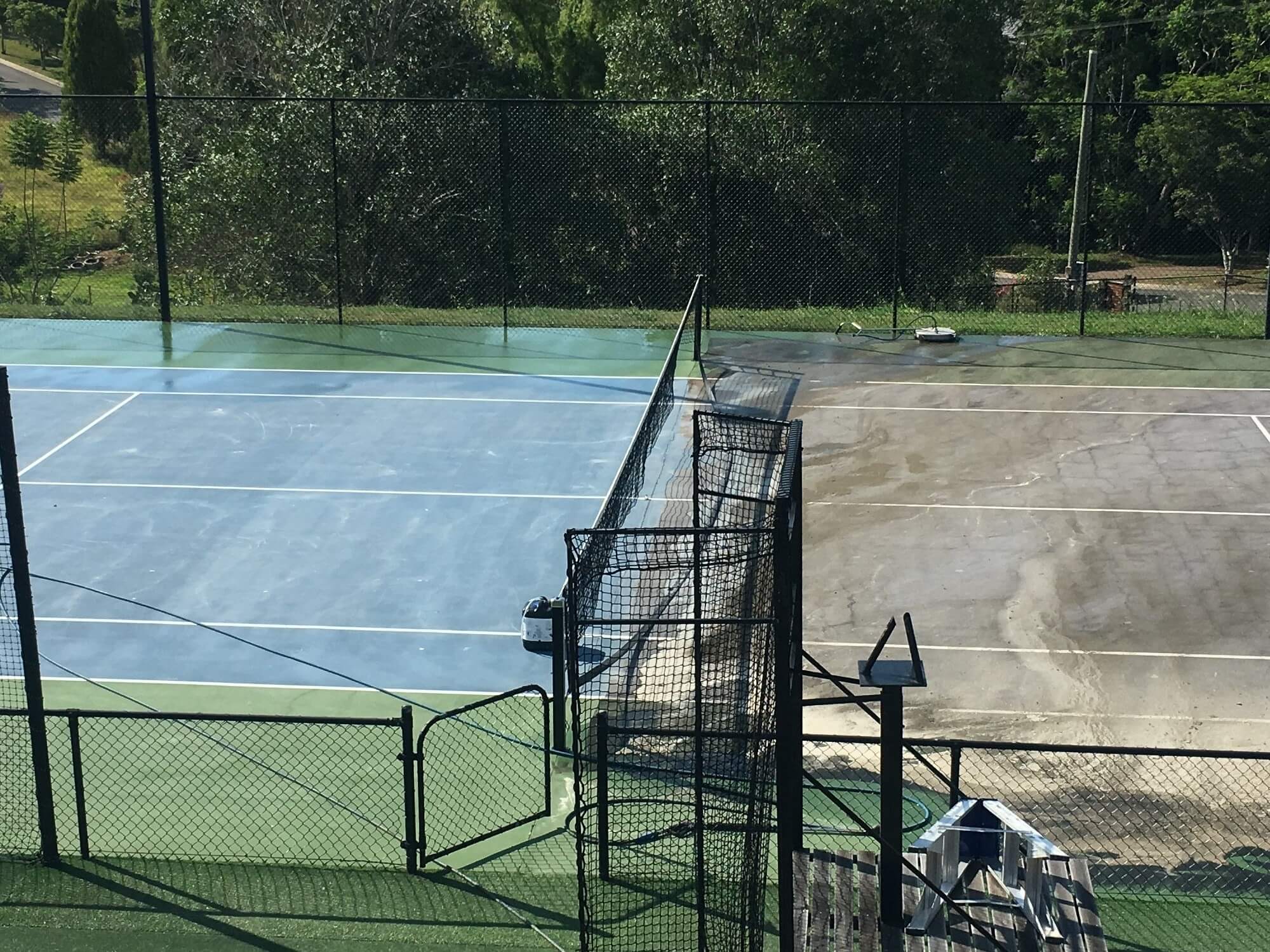 Tennis court cleaning in progress