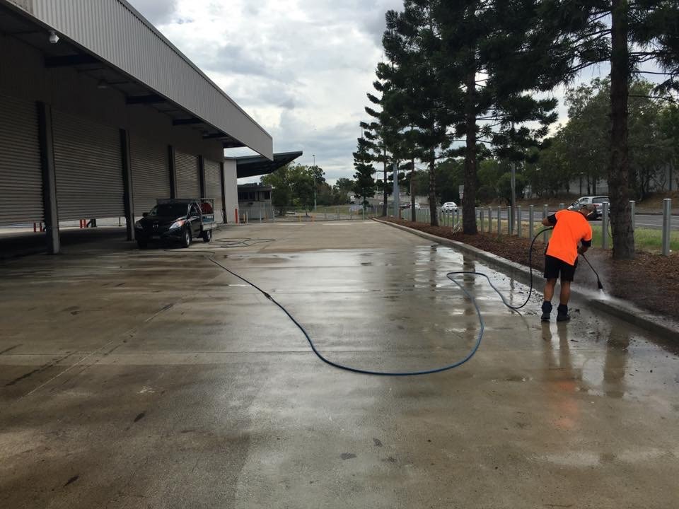 Man professionally cleaning a car park in Brisbane
