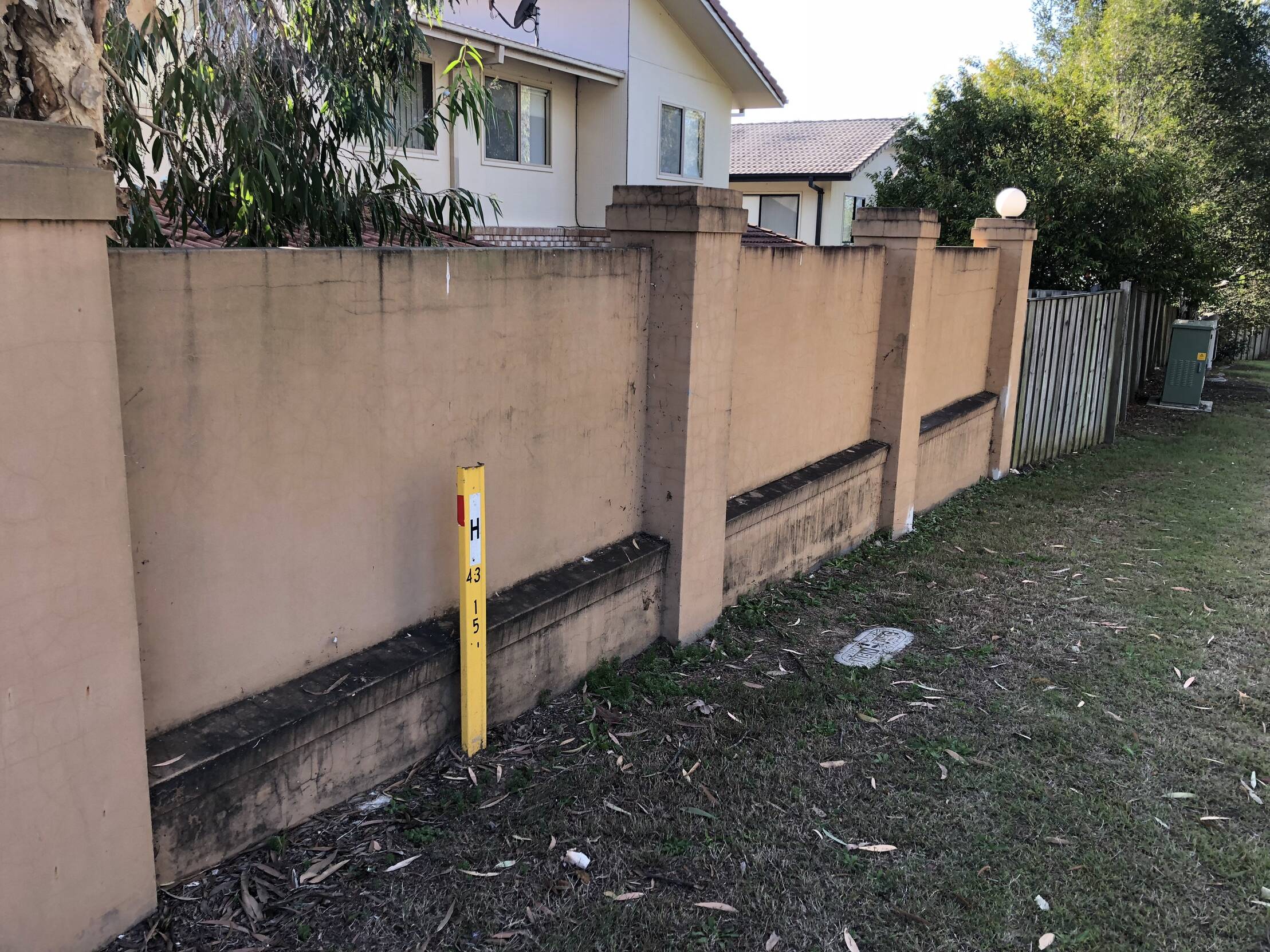 Front wall of a property on a residential street in need of a professional clean