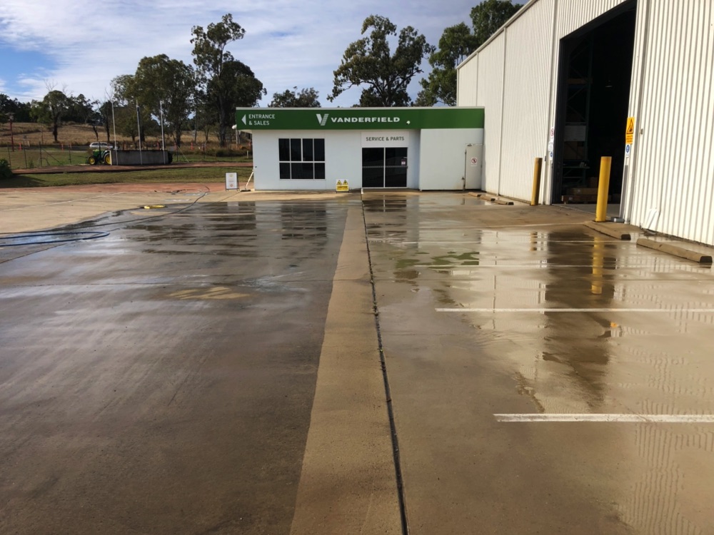 After photo of a car park clean, still wet